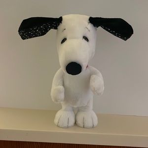 Peanuts happy dance snoopy dog .